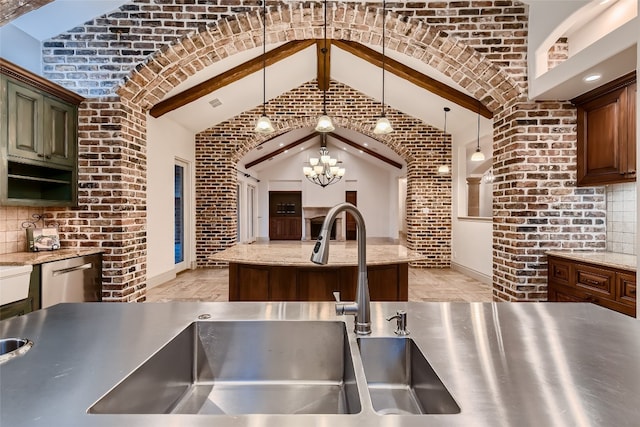 kitchen featuring pendant lighting, a chandelier, decorative backsplash, vaulted ceiling with beams, and brick wall