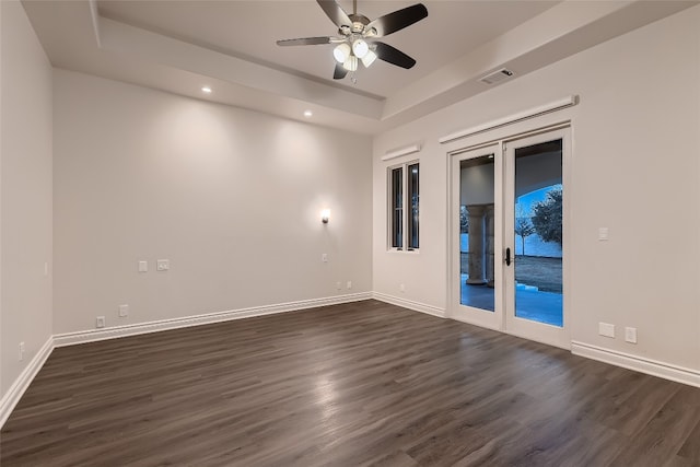 unfurnished room with dark hardwood / wood-style floors and ceiling fan