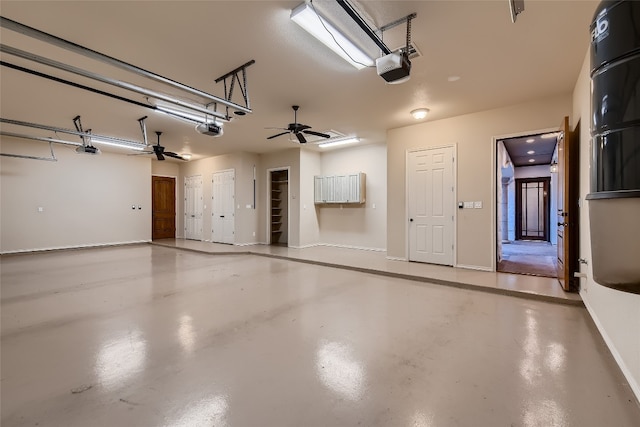 garage with ceiling fan and a garage door opener