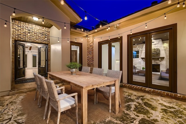 patio at night featuring french doors