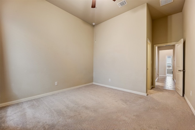 carpeted empty room with ceiling fan