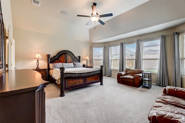 bedroom with ceiling fan, lofted ceiling, and light carpet