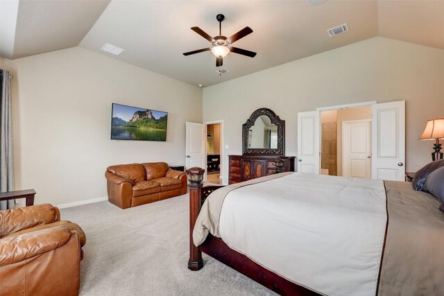 carpeted bedroom with vaulted ceiling and ceiling fan