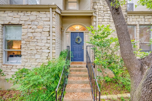 property entrance with a fireplace