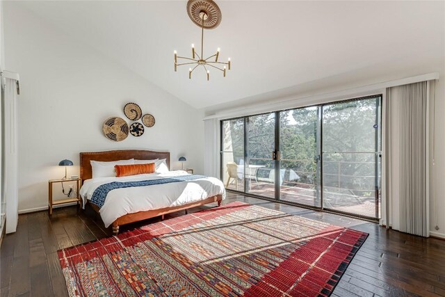 bedroom featuring access to exterior, dark hardwood / wood-style flooring, high vaulted ceiling, and a notable chandelier