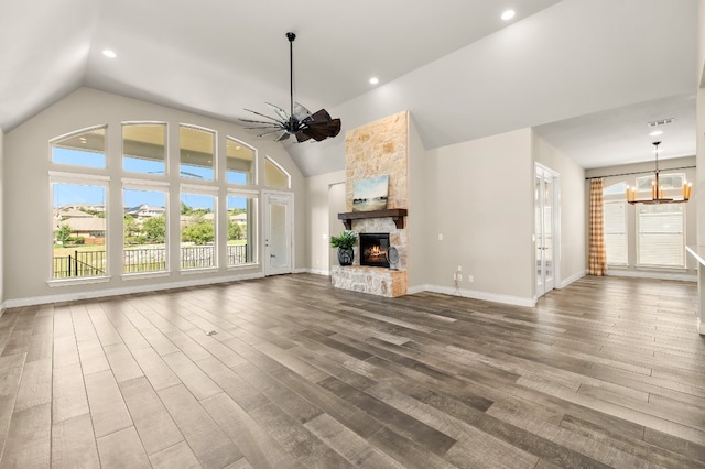 unfurnished living room featuring hardwood / wood-style floors, a wealth of natural light, and a fireplace