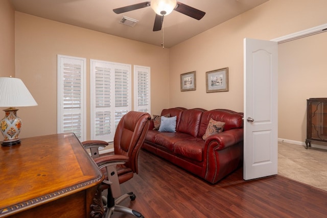 office space with dark hardwood / wood-style flooring and ceiling fan