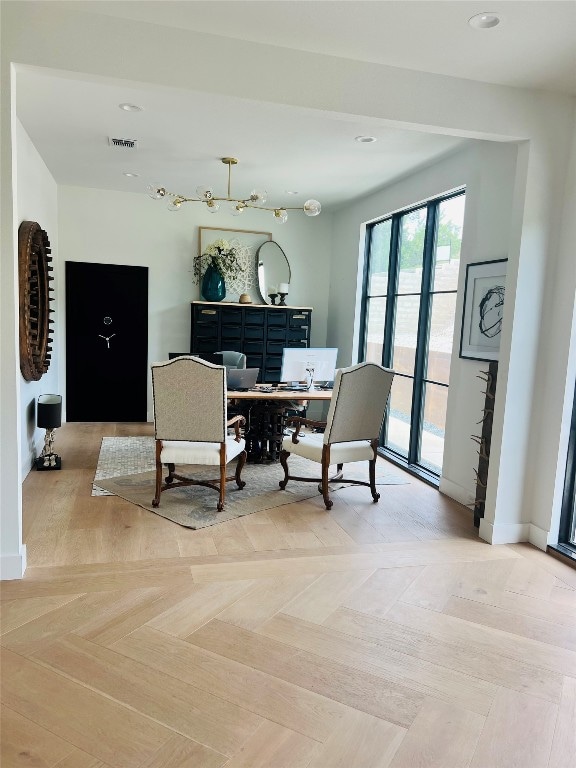 dining area featuring light parquet flooring