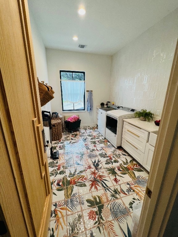 laundry room featuring separate washer and dryer