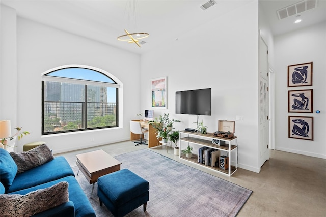 living room featuring a chandelier