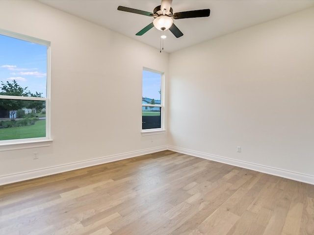 empty room featuring ceiling fan and light wood-type flooring