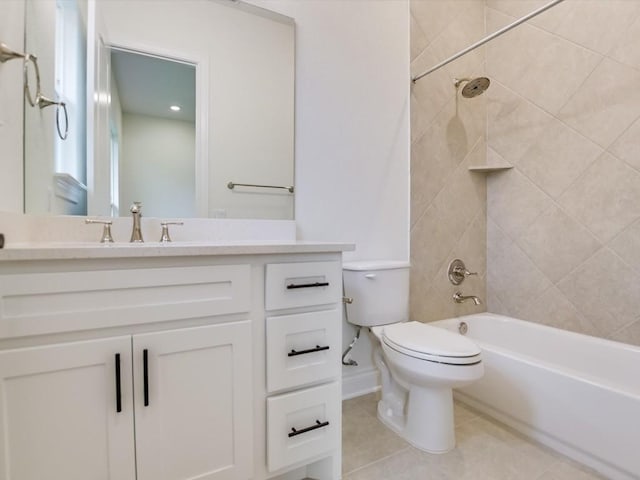 full bathroom with tiled shower / bath combo, vanity, tile patterned flooring, and toilet