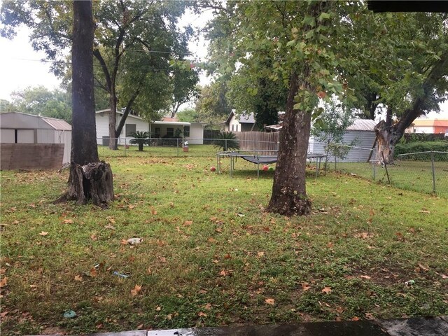 view of yard featuring a trampoline