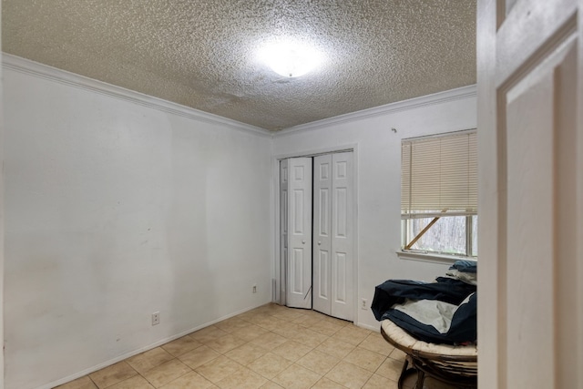 interior space featuring crown molding, light tile floors, and a textured ceiling