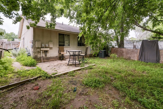 view of yard featuring a patio and central AC unit