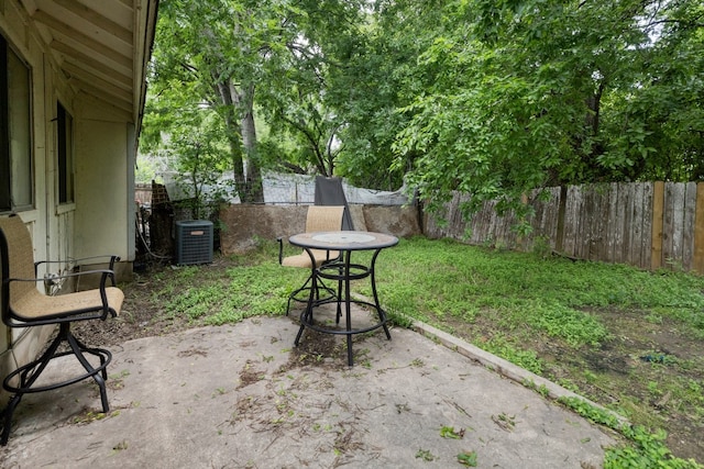 view of yard featuring a patio and central AC unit