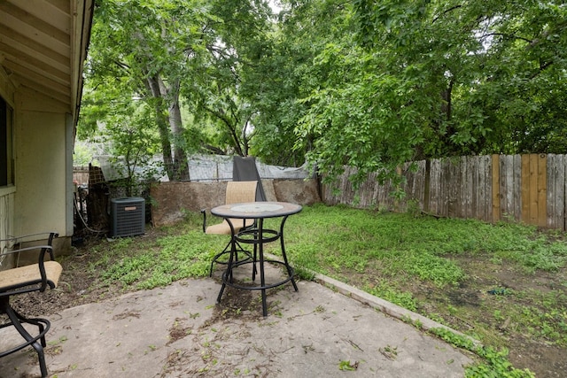 view of yard featuring a patio and central air condition unit