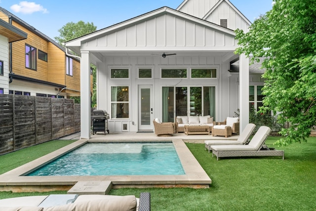 back of house with a patio, an outdoor hangout area, ceiling fan, and a lawn