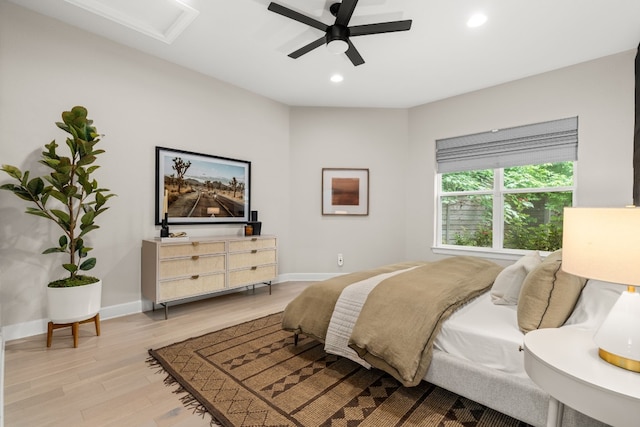 bedroom with light wood-type flooring and ceiling fan