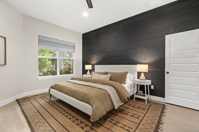 bedroom featuring light hardwood / wood-style floors and ceiling fan