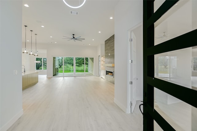 hall with light hardwood / wood-style floors