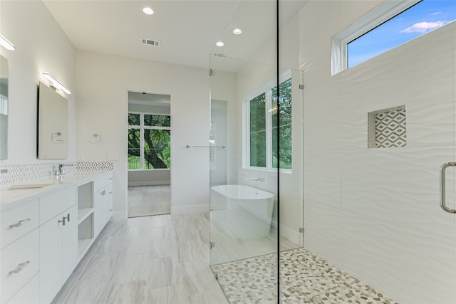 bathroom featuring tile floors, plenty of natural light, and vanity