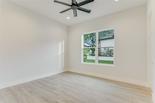 spare room featuring ceiling fan and light hardwood / wood-style floors