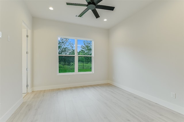 unfurnished room with ceiling fan and light hardwood / wood-style flooring