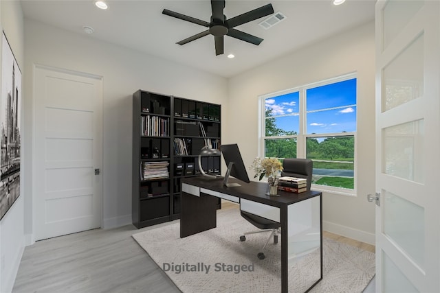 home office featuring ceiling fan and light wood-type flooring