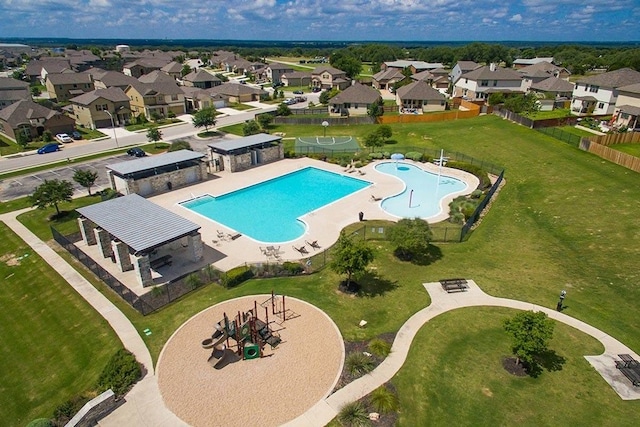 view of swimming pool featuring a yard and a patio area