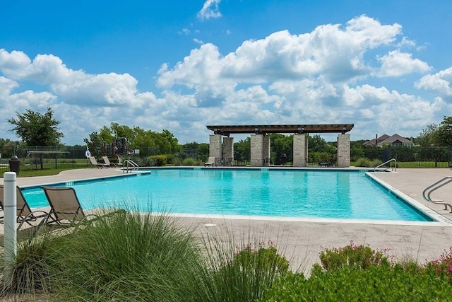 view of pool featuring a patio area