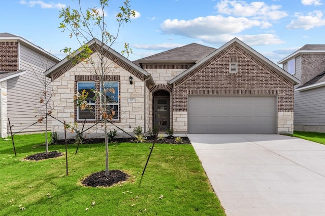 view of front of home featuring a front yard and a garage