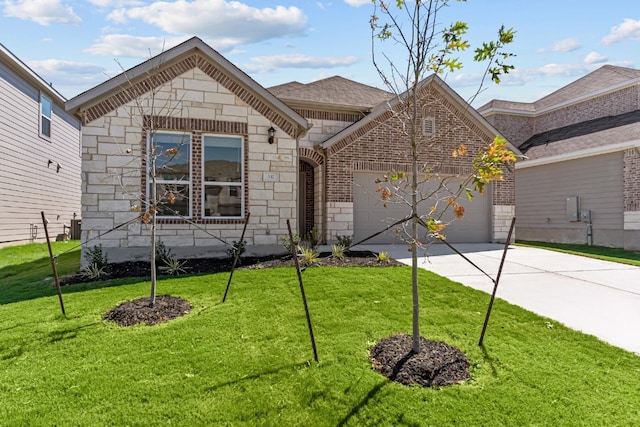 view of front facade with a front yard and a garage