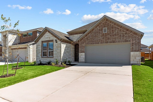 front facade featuring a garage and a front lawn