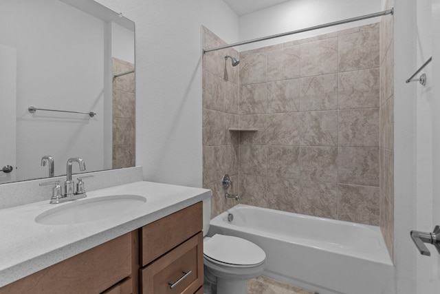 full bathroom featuring vanity, toilet, and tiled shower / bath combo