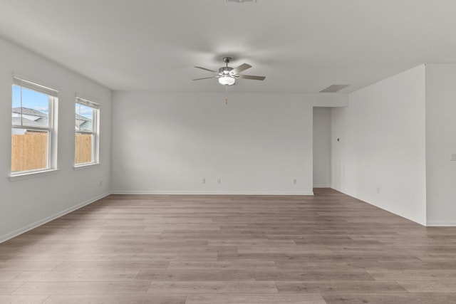 unfurnished room with light hardwood / wood-style floors and ceiling fan