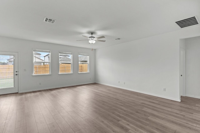 unfurnished room featuring light hardwood / wood-style floors and ceiling fan