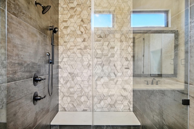 bathroom with tiled shower