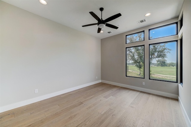 empty room featuring light hardwood / wood-style floors and ceiling fan