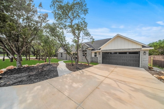 view of front facade with a garage and a front lawn