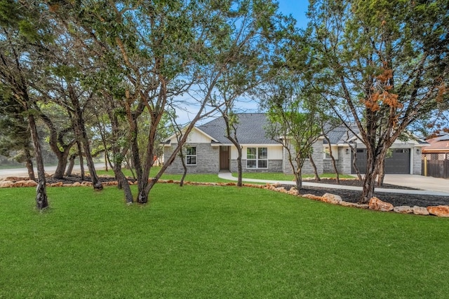 single story home with a front yard and a garage