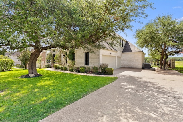 view of front of home featuring a front yard and a garage