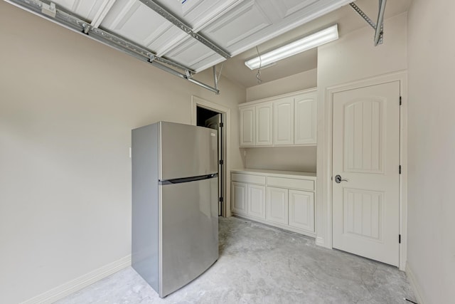 garage featuring stainless steel fridge