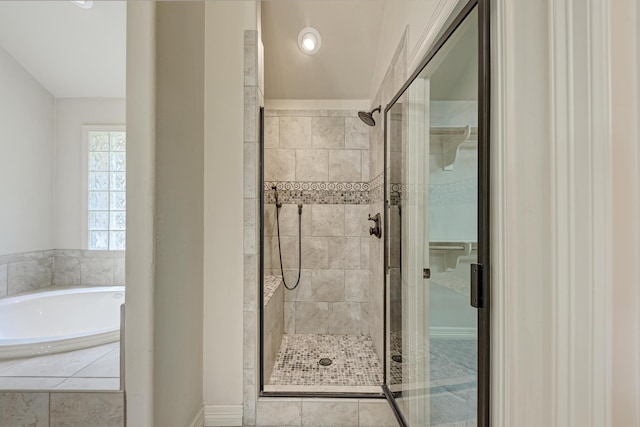 bathroom with shower with separate bathtub