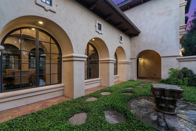 exterior entry at dusk with french doors