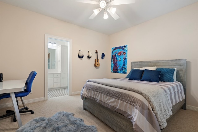 carpeted bedroom featuring ceiling fan and ensuite bathroom