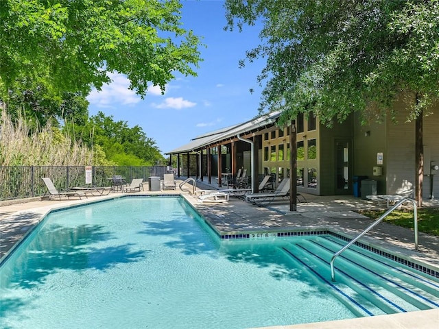 view of swimming pool featuring a patio area