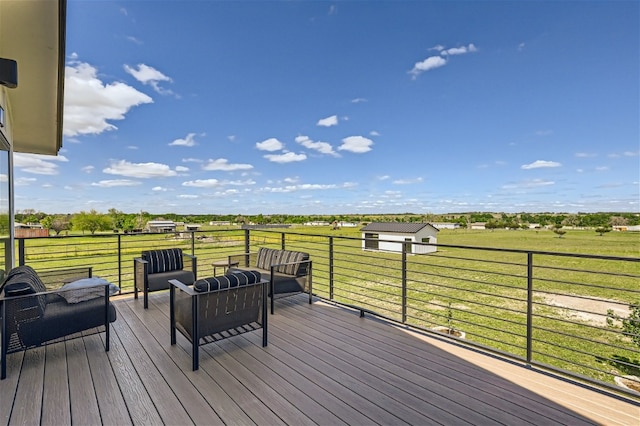 wooden deck with a rural view and a yard