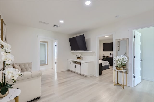 living room with light hardwood / wood-style floors