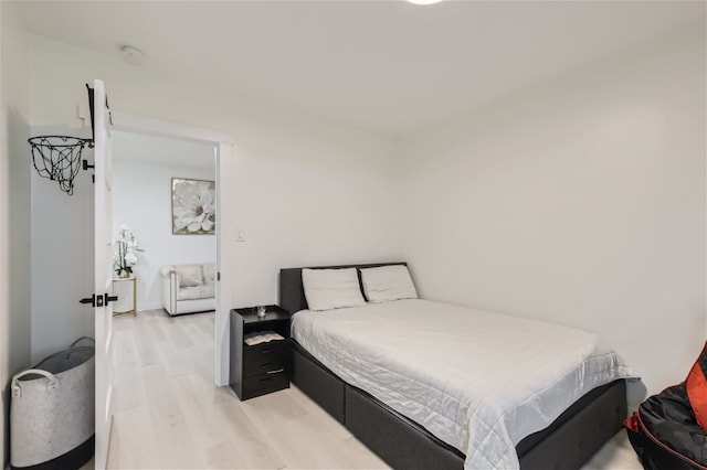 bedroom with light hardwood / wood-style floors